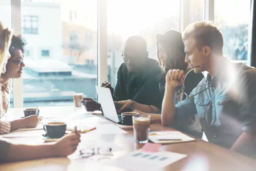 Young employees sitting in the meeting room