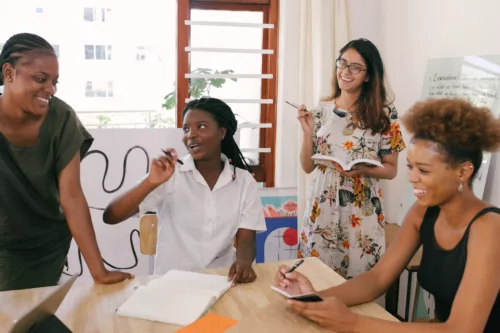 Group of women around a table discussing