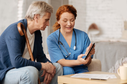 Joyful excited nurse explaining something to her patient