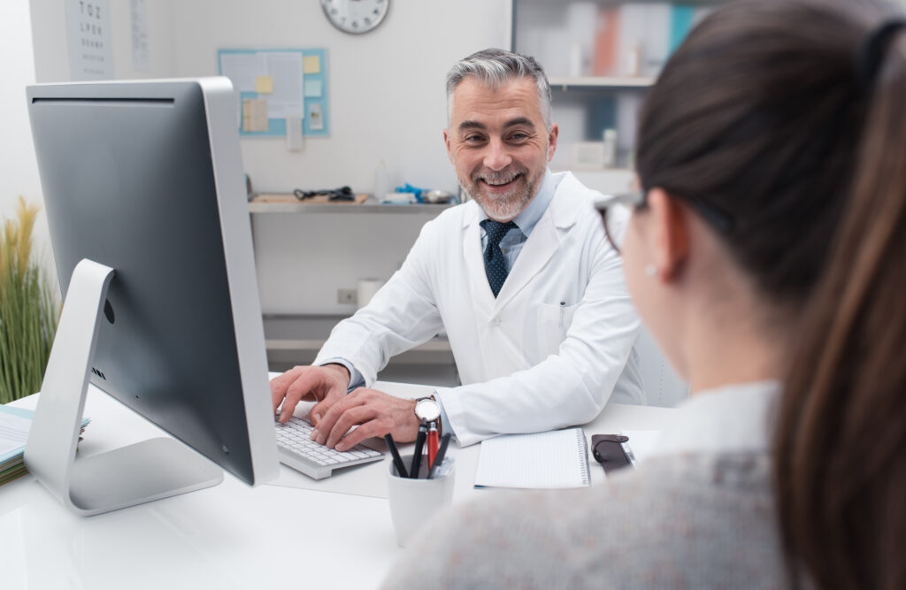 Doctor working with his computer