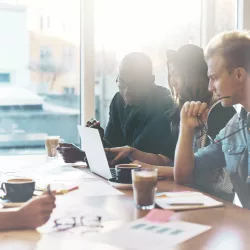 Young employees sitting in the meeting room