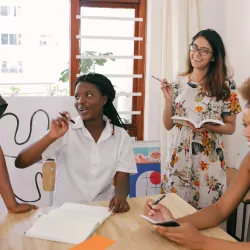 Group of women around a table discussing