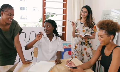 Group of women around a table discussing